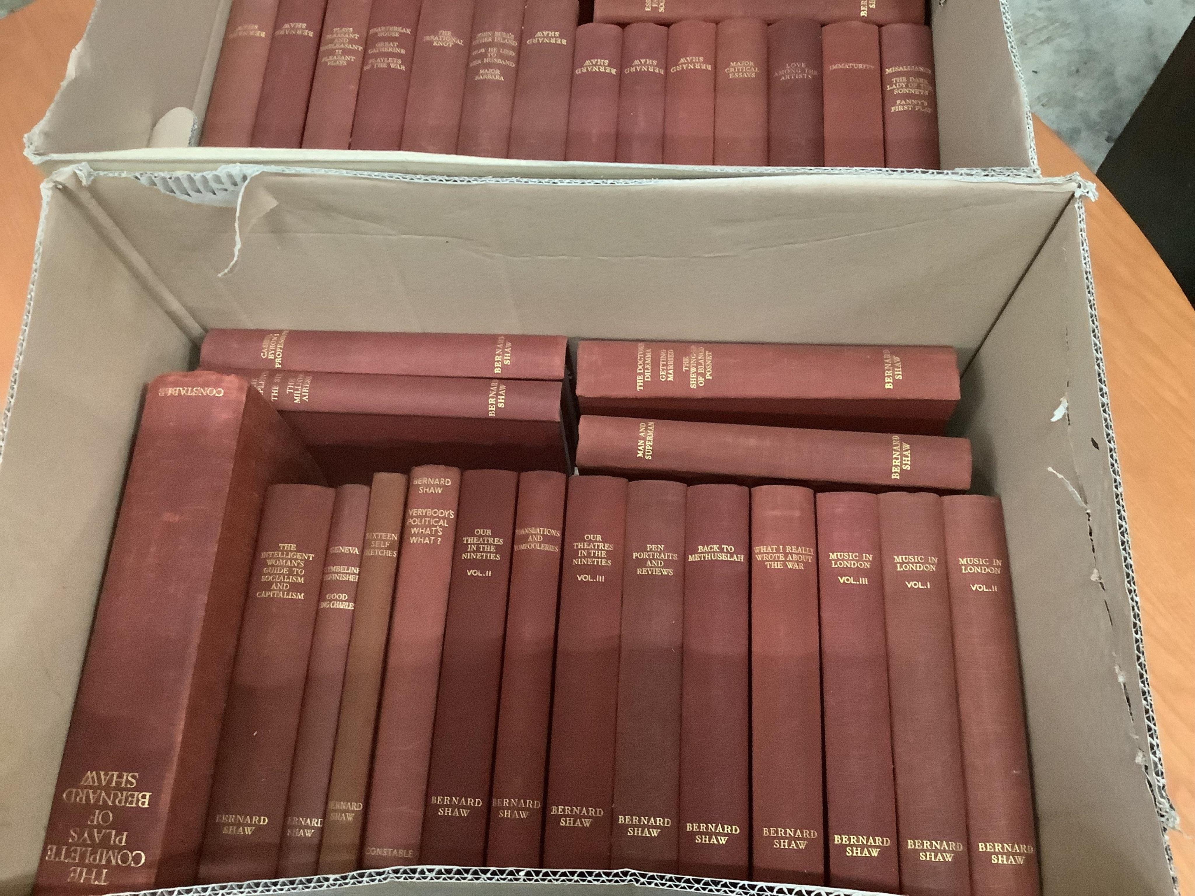 Two boxes of Bernard Shaw books and one box of Thomas Hardy books, approximately 57 volumes